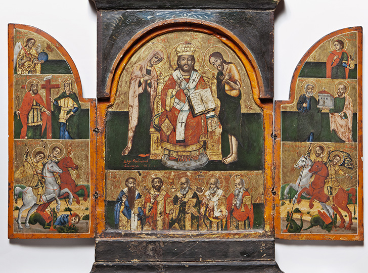 Painted tryptich with religious imagery and saints